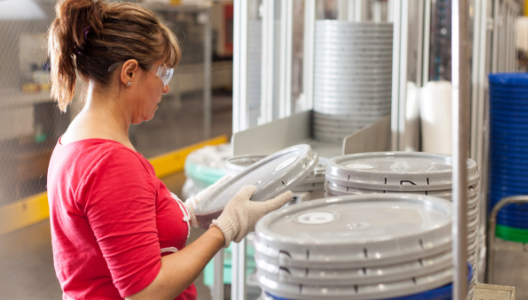 woman sorting lids