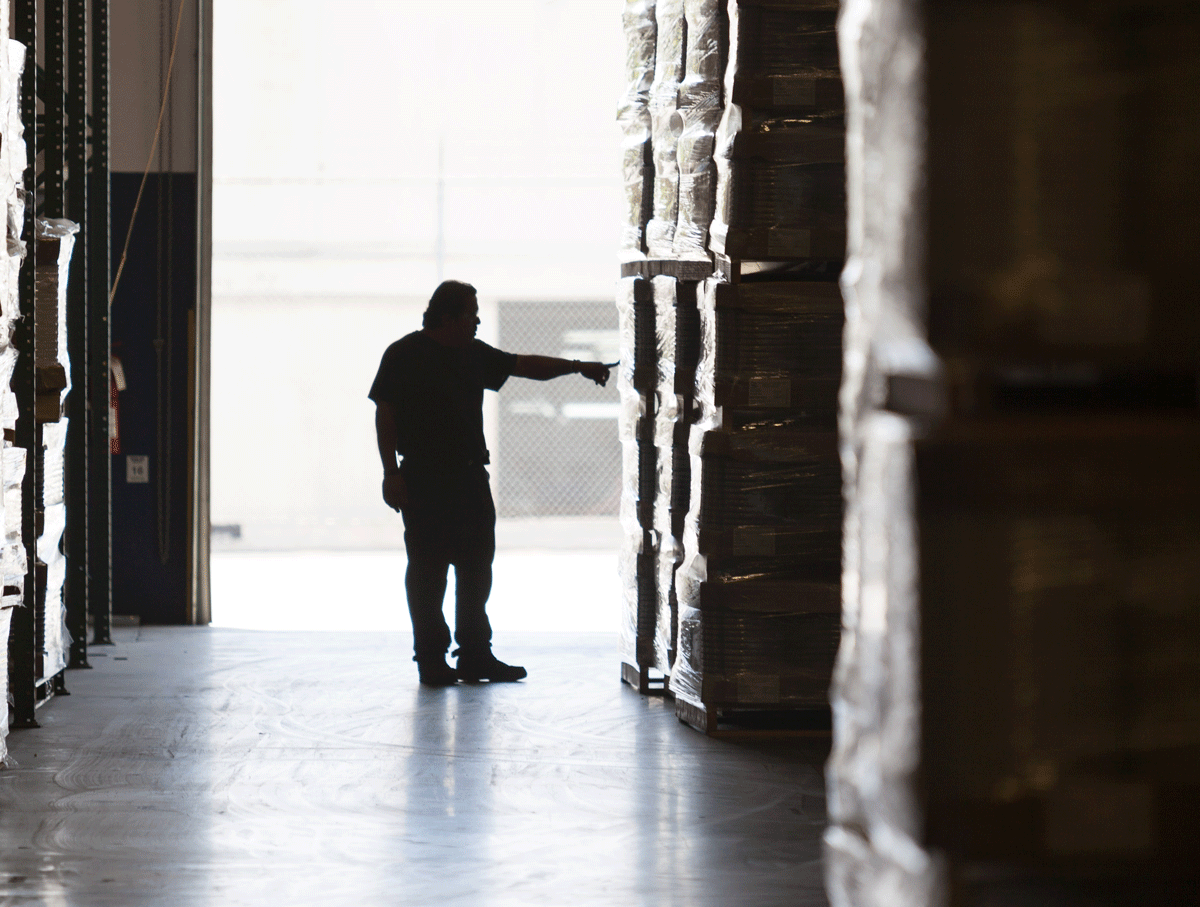 silhouette of man in warehouse
