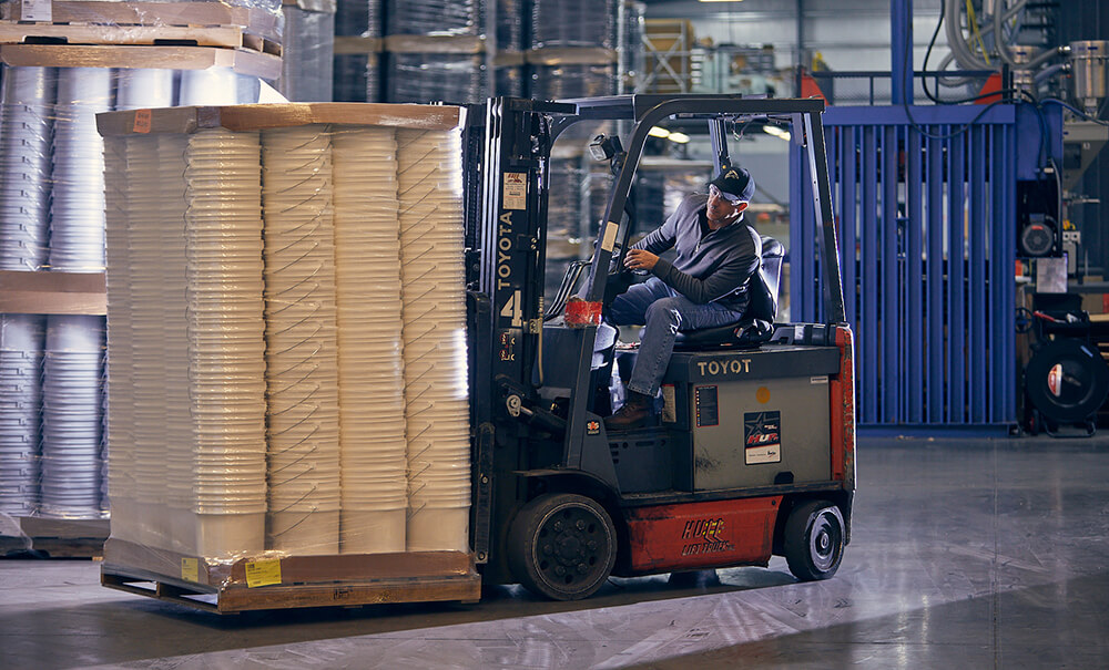 Man driving fork lift